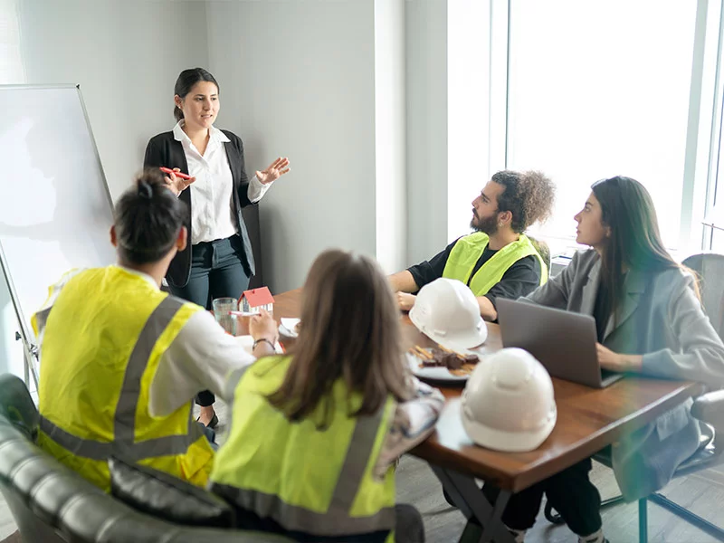 Multi-agency project team coordinating at a infrastructure site meeting